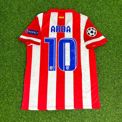 Red and white striped soccer jersey with number 10 and name 'Arda' on a green grass background
